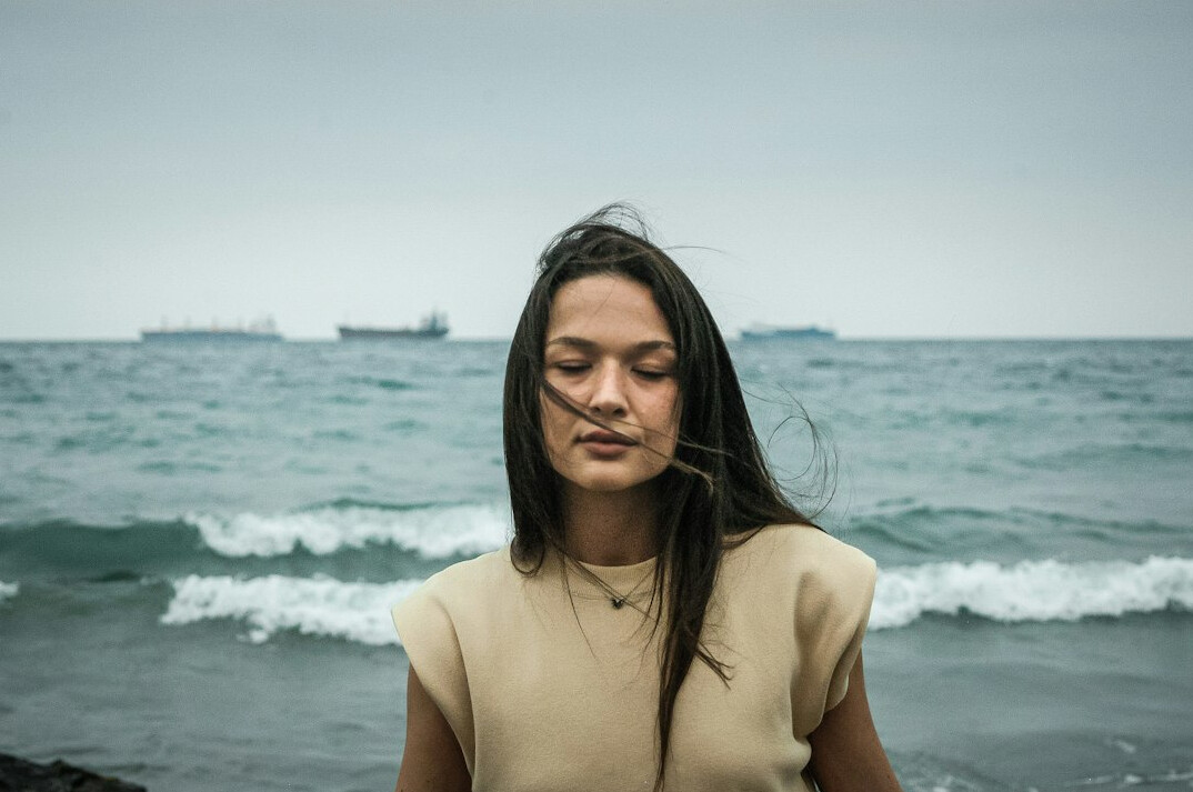 Young woman with dark hair calm portrait