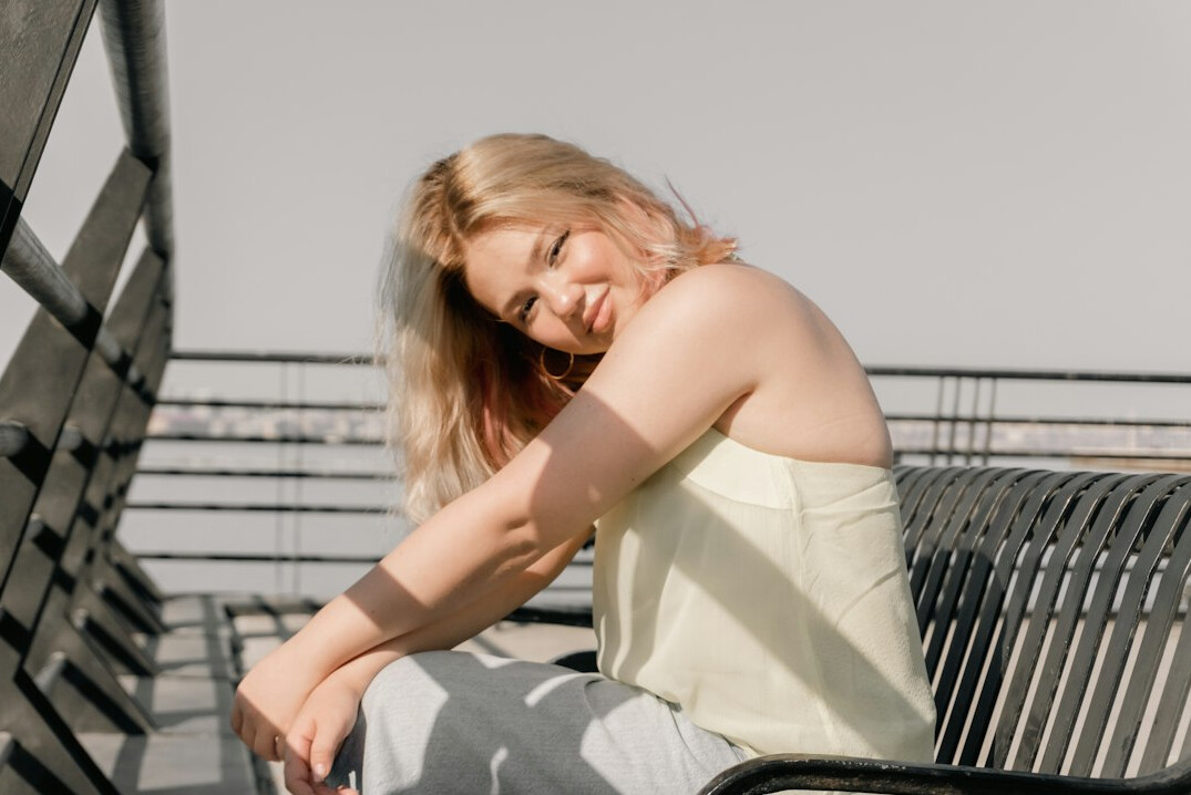 Blonde young woman smiling portrait