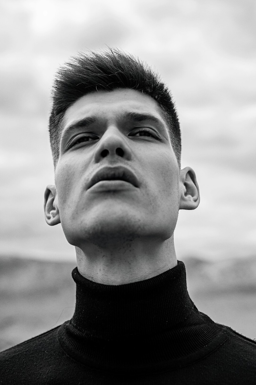 Young man with short dark hair portrait